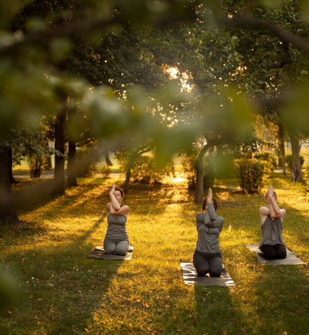 full-shot-women-meditating-nature_23-2149698175